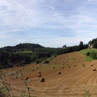 This hay field functions as our front yard. Our current home is on the right ... and a Dordogne chateau is in the center of the photo, in the distance.