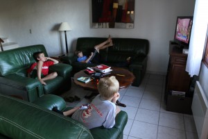 The boys watching rhythmic gymnastics qualifying rounds ... on French television.