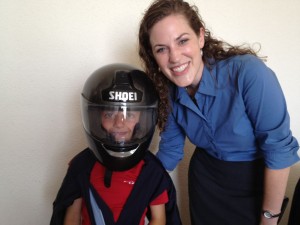 Courtney of World Relief scored some Cool Points by letting the boys try on her motorbike helmet.
