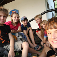 Peter, Suuzanne, and Sahale treat our boys to life riding without a roof.