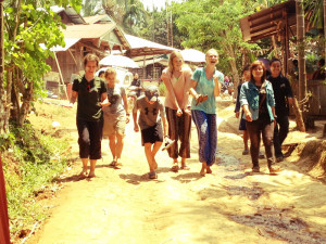 Amy, Hosannah, Ayana, and Annie after being doused with water and face paint during a village festival.